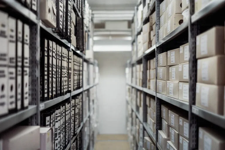 Archive shelves filled with document boxes and binders